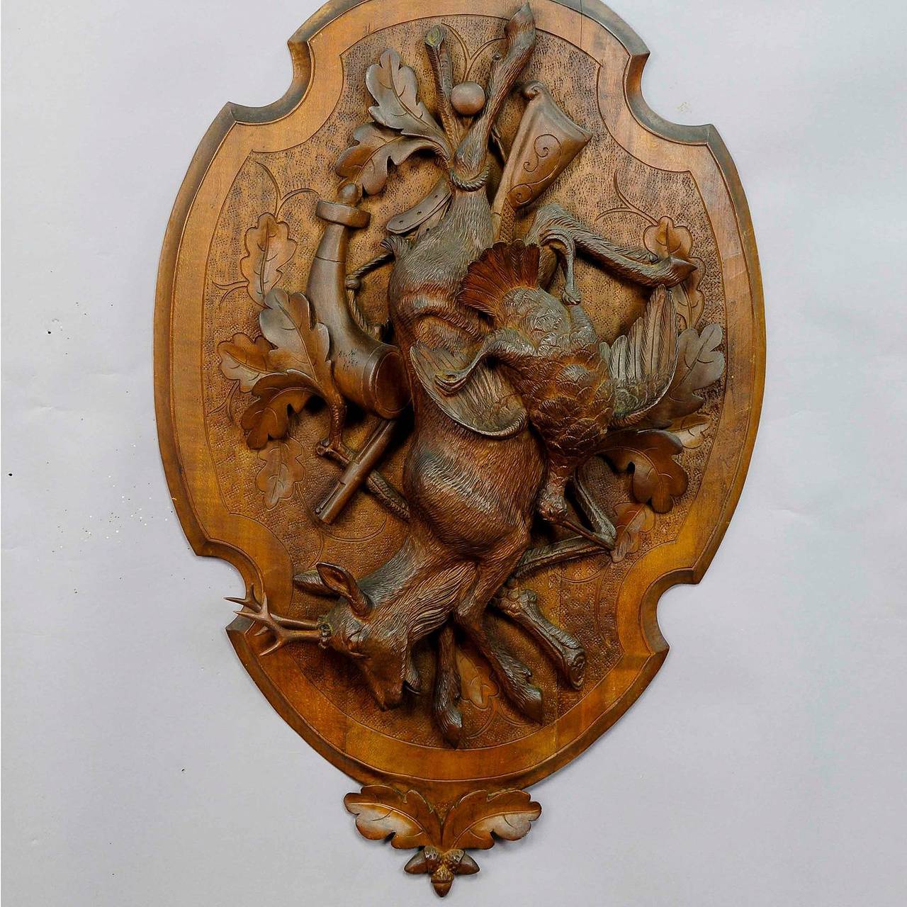 a pair carved game plaques with deer and ibex, swiss ca. 1890