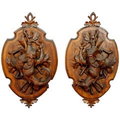 a pair carved game plaques with deer and ibex, swiss ca. 1890