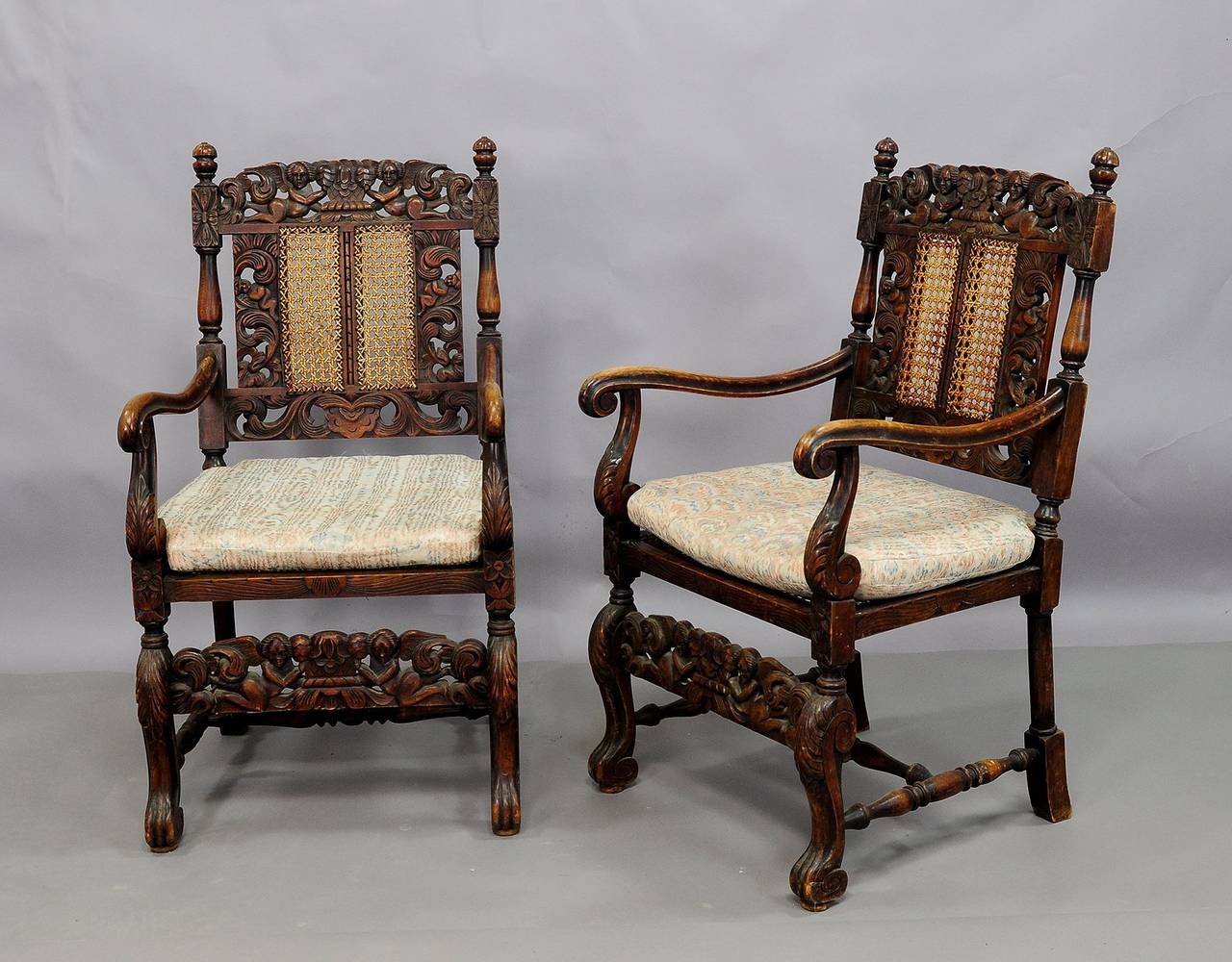 A pair of elaborately carved north german armchairs. base and backrest with carved cherubs, turned and carved legs and armrests.

shippig cost depend on the delivery address and the selected service. please contact us for a detailed shipping quote.