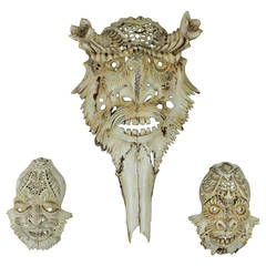 a set of three impressive carved deer skulls