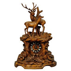 black forest carved wood mantelpiece clock with stag and doe