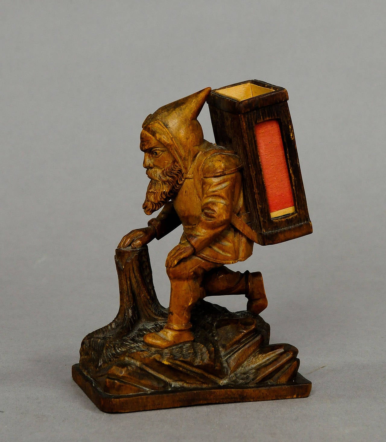 a lovely carved wood dwarf with matchbox holder on his back. swiss, brienz ca. 1900.