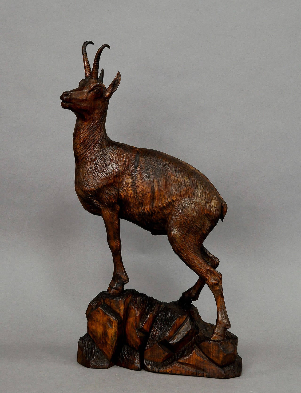 a large handcarved wood chamois. executed by the famous austrian wood carver ernst heissl ca. 1890. base with artists signature.