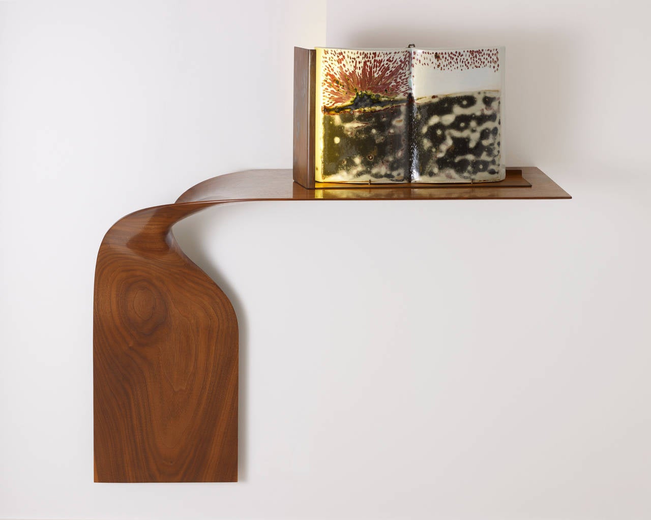 A masterpiece in Minimalist design and craftsmanship, this sculptural hand-carved wall console by Dublin-born and Manhattan-based interior designer Carol Egan lies at the crossroads of past and future. Very pure and simple in style, this wall