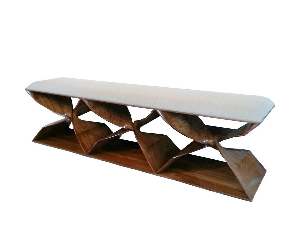 This ‘Sculptural Twist’ three-seater bench is designed by blending digital technology with fine traditional craftsmanship. It is part of Carol Egan’s line of contemporary furniture whose timeless elegance has become iconic. Carved in walnut, the