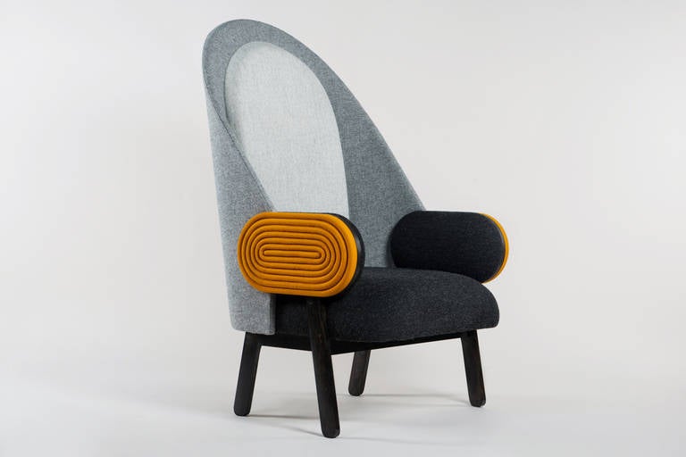 By French Lebanese designer Charles Kalpakian, 'Moon' is a contemporary armchair with a vintage twist in Kvadrat upholstery. Its very high back and its unusual width and depth (80 cm both) make it particularly welcoming and comfortable. This