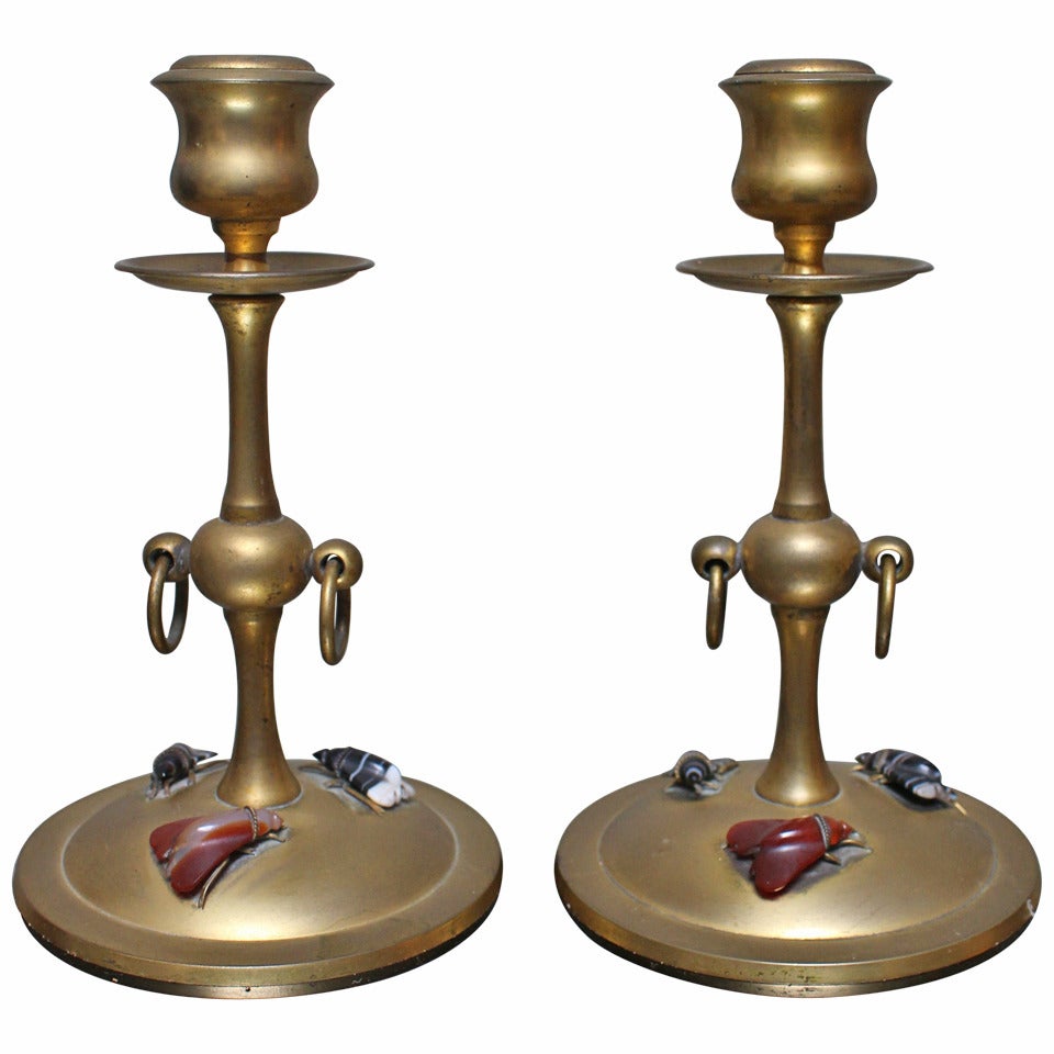 Pair of Bronze Candlesticks with Carved Stone Moths
