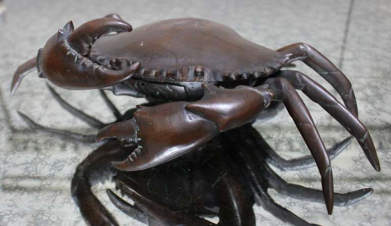 A bronze crab inkwell.