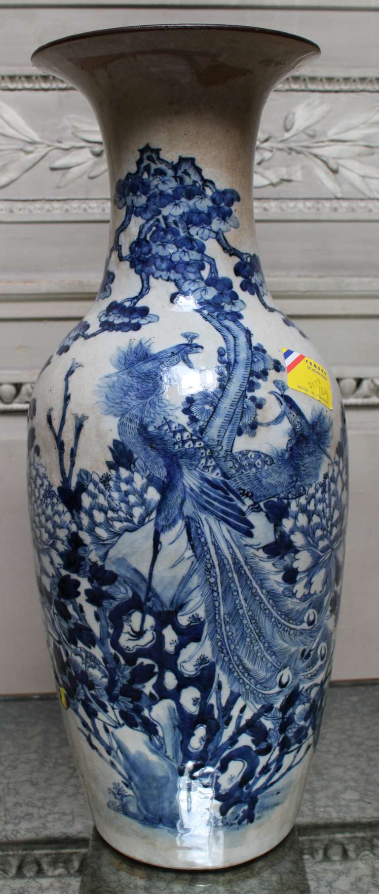 A Blue and White Chinese Vase with Peacock and Floral Design