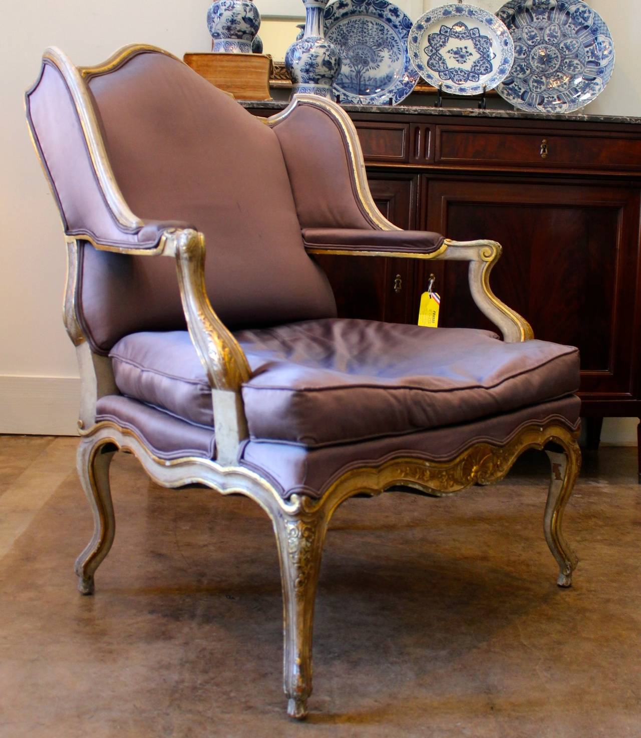 A French Regence Style Painted and Parcel Gilt Fauteuil de Confessionnal