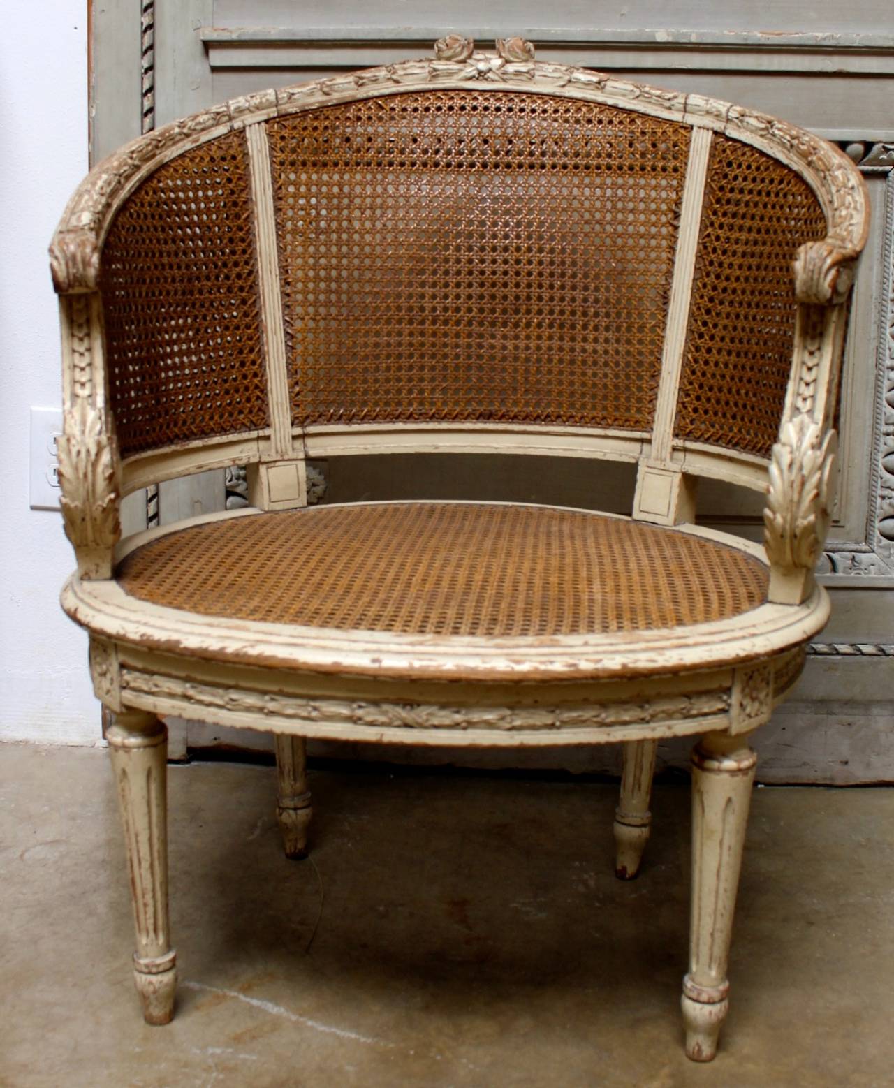 Pair of French Louis XVI Style Caned Bergeres in a Painted Finish In Good Condition In Dallas, TX