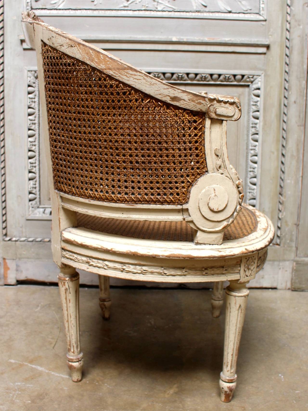 Pair of French Louis XVI Style Caned Bergeres in a Painted Finish 1