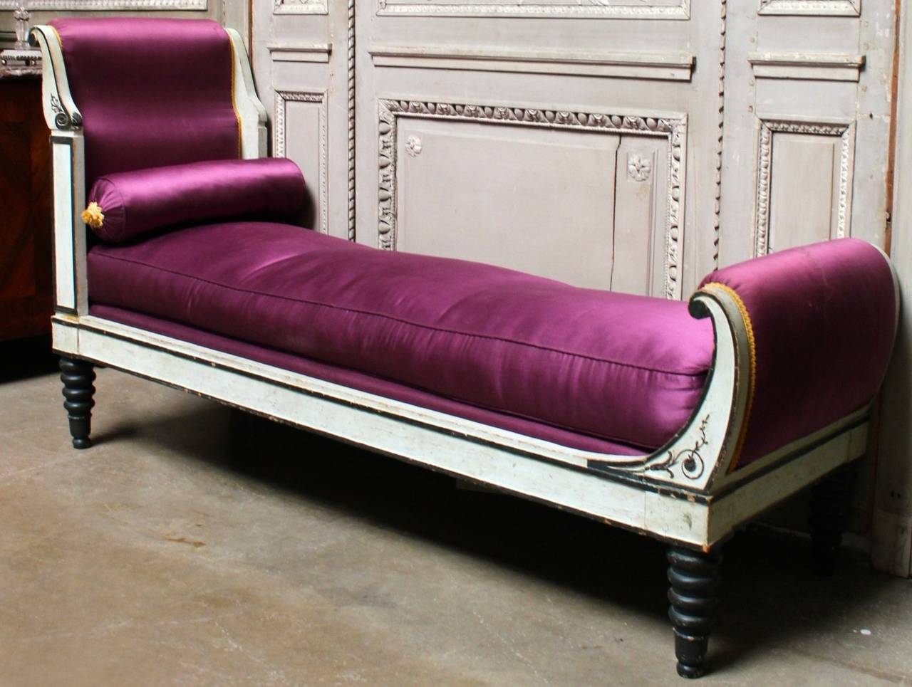 French Directoire period Recamier, chaise lounge in a black and white painted finish from the late 18th century. This Recamier is in an old painted finish, but likely not original paint. The finish is a dark charcole and white with a touch of gray.