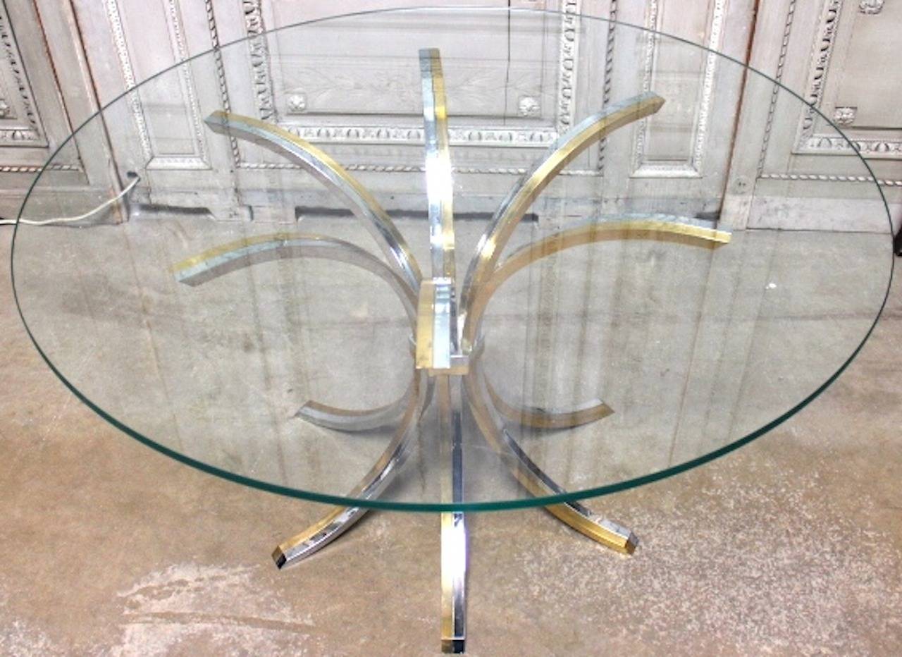 A Brass and Chrome Table with Glass Top