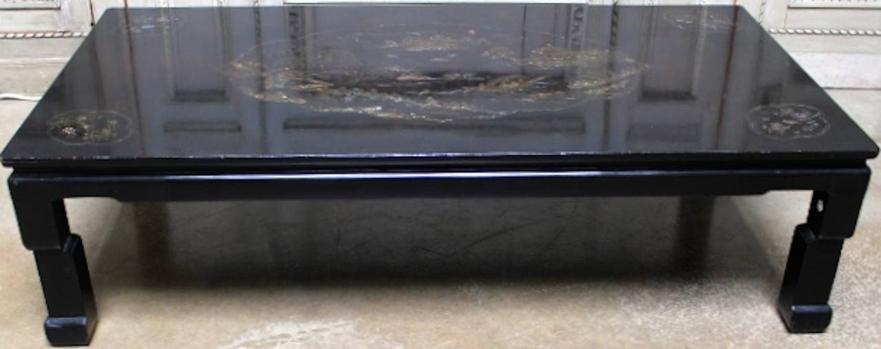 Mid-20th century Chinese coffee table with a black lacquer finish with mother of pearl inlay.