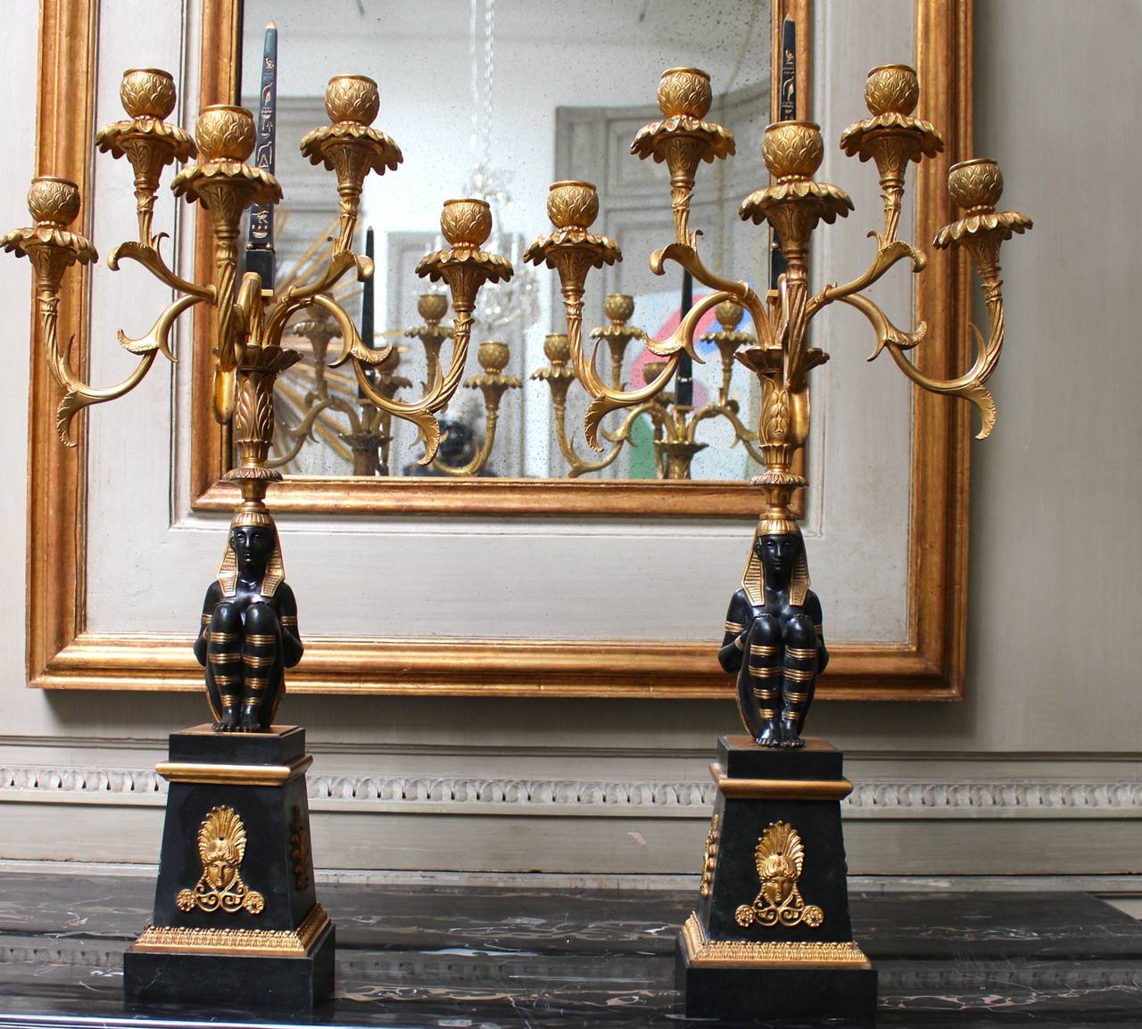 A pair of French Egyptian Revival first Empire style candelabras.