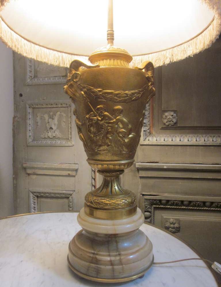 Rococo A Pair of 19th Century Bronze Lamps in the Manner of Clodion