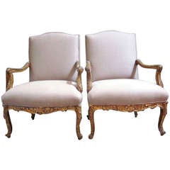 A Pair of Regence Style Gilded and Carved Fauteuils