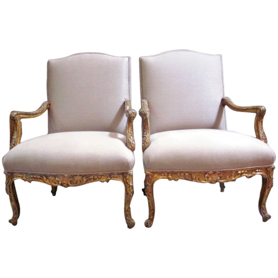 A Pair of Regence Style Gilded and Carved Fauteuils