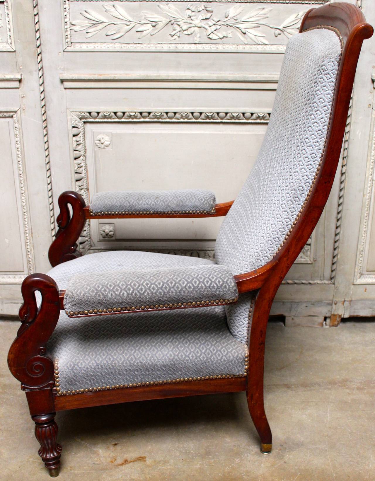 A French Charles X armchair in mahogany with swan motif.