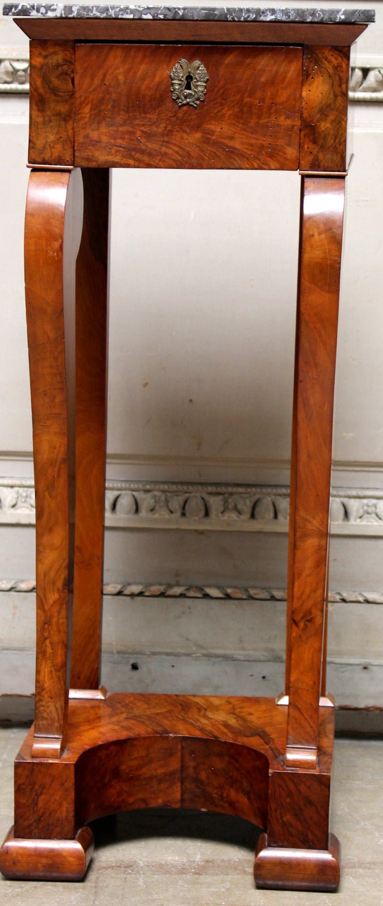 A French Charles X mahogany table, candle stand with a marble top.