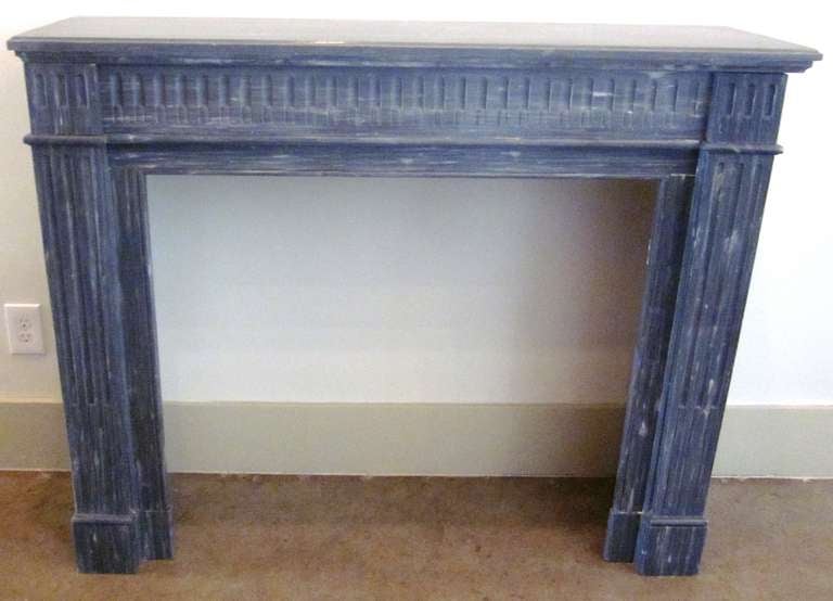 A French Louis XVI Style Blue Turquin Marble Mantle with Fluted Columns and Bronze Decorative Vents