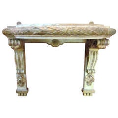 A Pair of French Carved Painted and Parcel Gilt Brackets