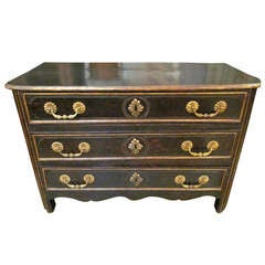 A French Ebonized Three Drawer Regence Commode