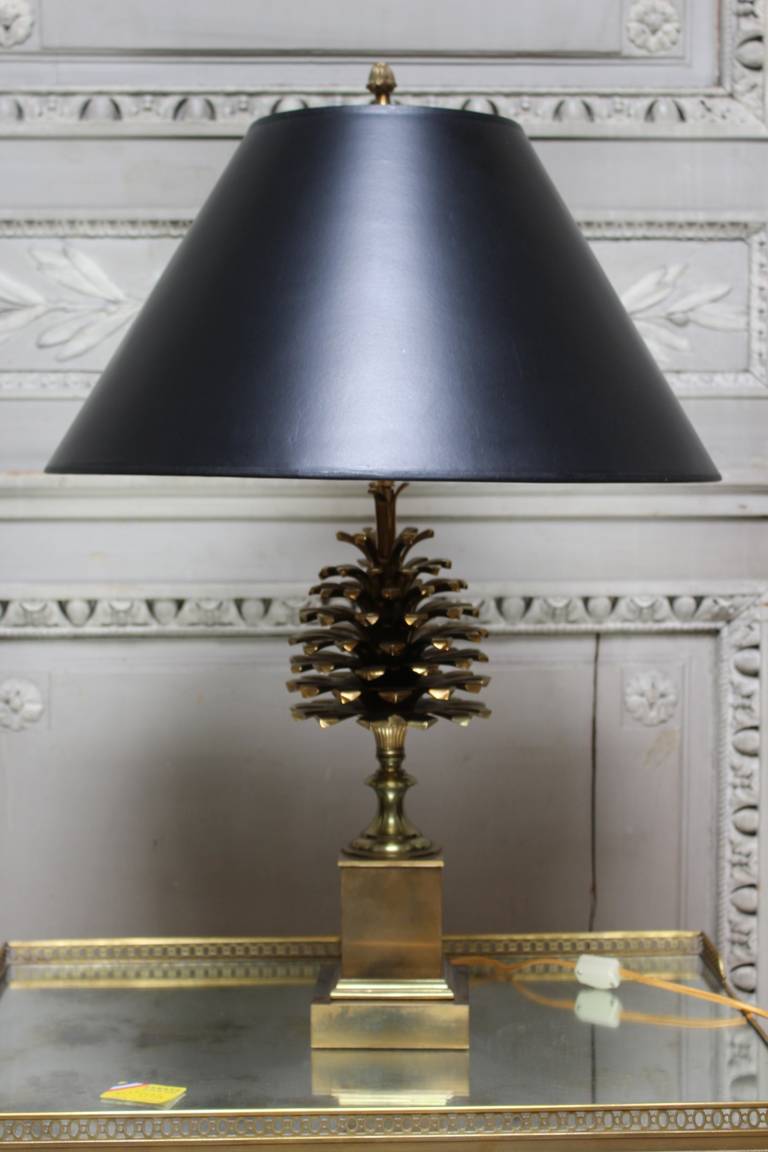 A French bronze lamp depicting a pine cone by Maison Charles.
The centre rod is adjustable, so the height can vary.