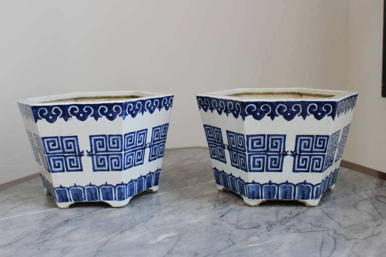 A pair of 19th century Chinese blue and white porcelain jardinieres in a tapering hexagon shape.