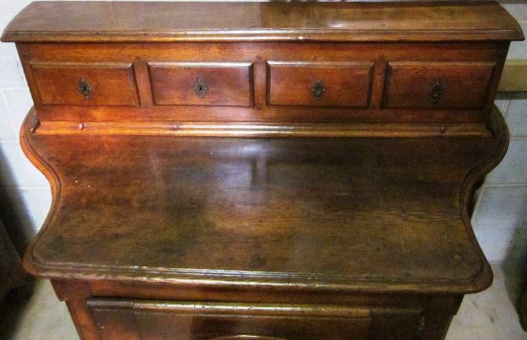 Hand-Carved 18th Century French Regence Cabinet in Carved Brown Oak For Sale