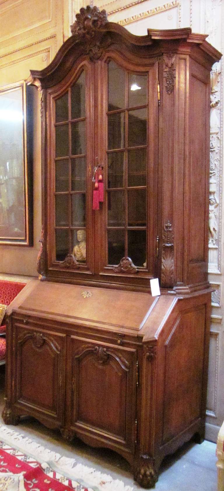 An 18th Century Belgian Regence Style Carved Oak Secretary Bookcase