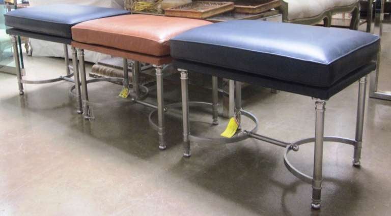 A set of three chrome and leather upholstered benches attributed to Maison Jansen.