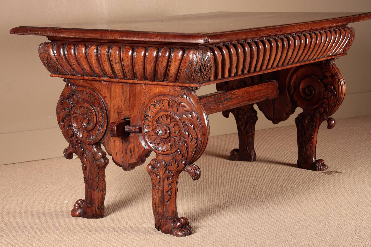 A remarkable Renaissance Table  of desirable and elegant proportions. This fine table would have been the centerpiece in a library displaying folio books. In excellent condition. Some wurming, some loss to corners of top and to paw feet.