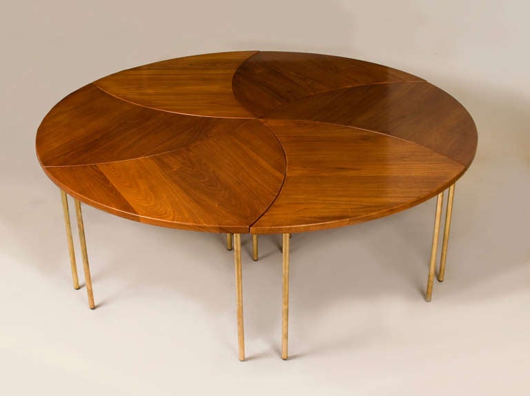 Exquisitely crafted set of six segmented and equally proportioned teak and brass tables. When combined, create a larger table of 51