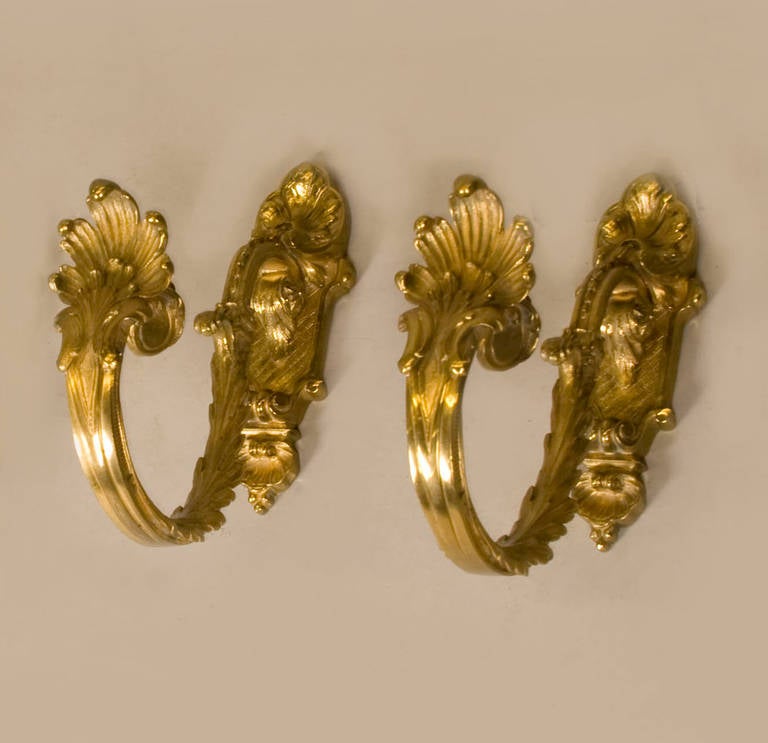 Finely detailed (hand chased) bronze d'ore hooks. Beautiful for 
guest towel display, or robe hooks, or curtain holders.