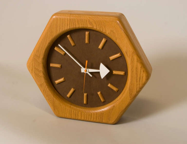 Oak Wall clock with Oak details, white hands with orange second hand by George Nelson for Howard Miller Clock Co. Zeeland, Michigan