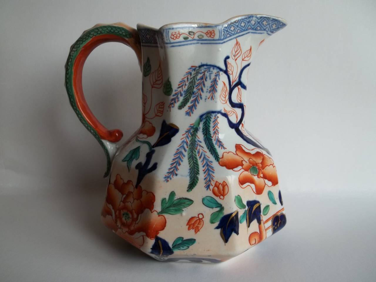 This is a very good Hydra Jug with an octagonal shape and a snake loop handle made by Hicks and Meigh, England.

The jug is made of Stone China ( Ironstone pottery) 

Hicks and Meigh was a partnership between Richard Hicks and Job Meigh who formed a