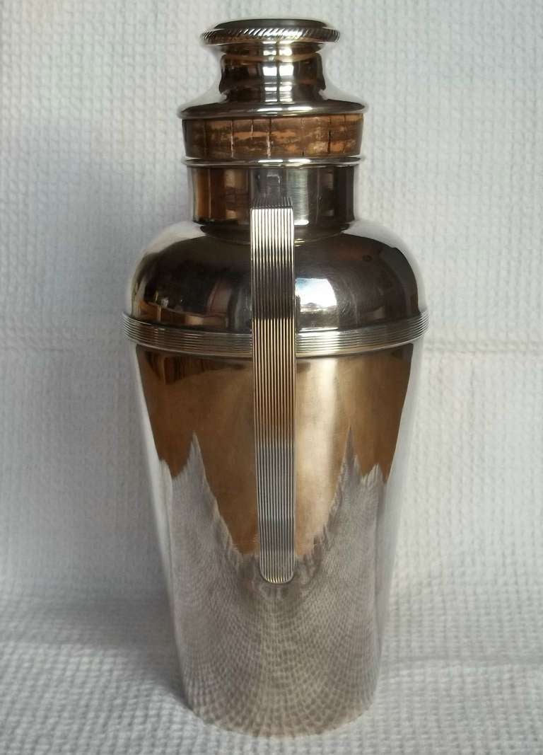 This is an excellent quality COCKTAIL SHAKER made by JAMES DIXON & SONS (J D & S) of Sheffield, England for HARRODS, London, UK.

This desirable and usable piece dates back to the 1930's, ART DECO Period
The shaker is made from Electro Plated