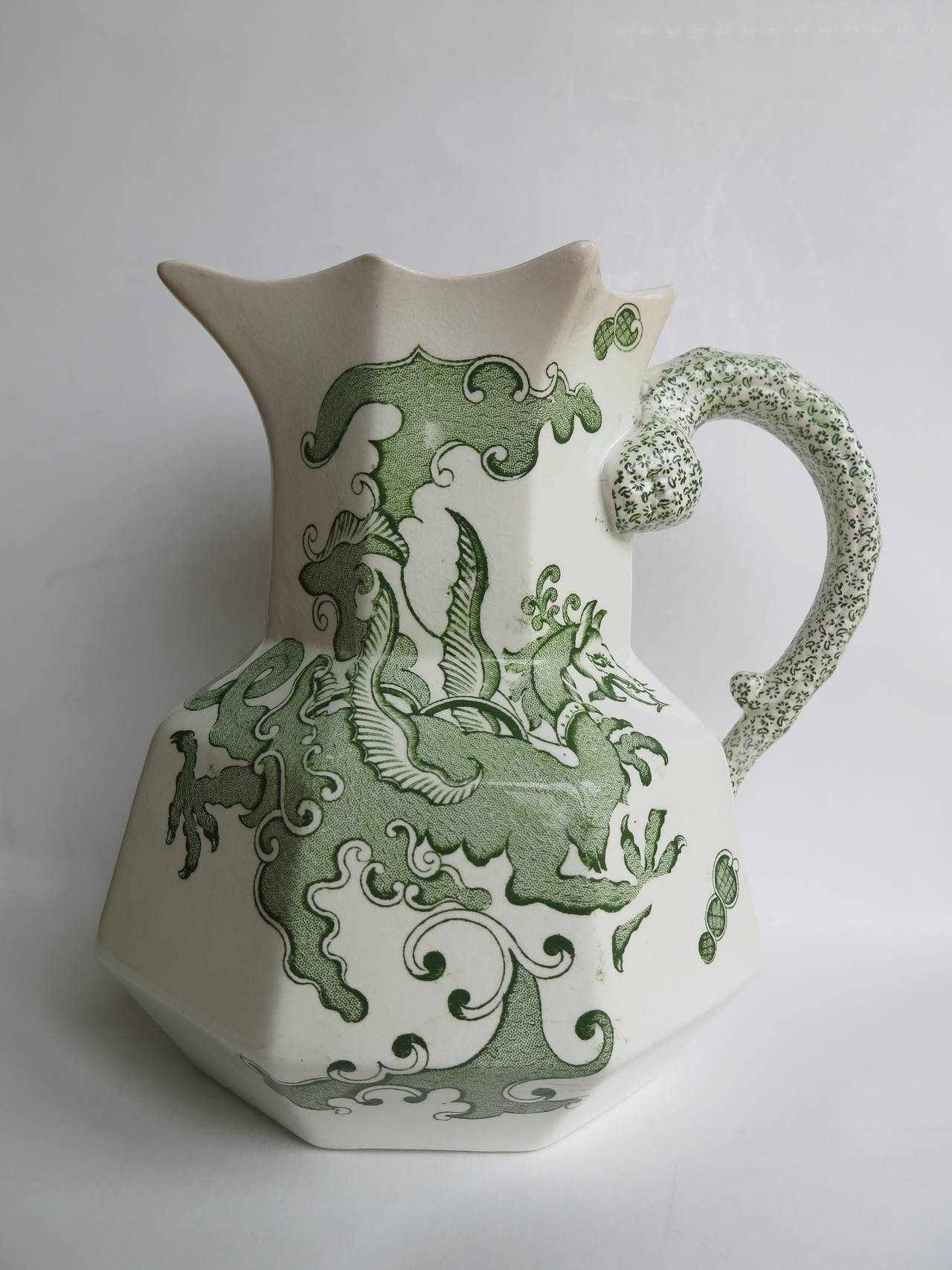 This is a very good Hydra Jug or pitcher by Mason's Ironstone, England. 

The Jug is octagonal in shape with the snake handle. These jugs were made in a range of sizes, varying from a small of under three inches high to large, such as this at over