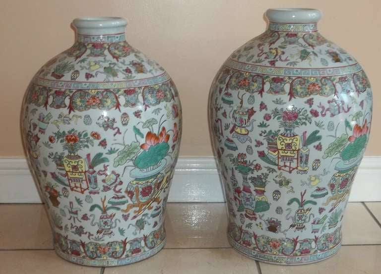 These are a Superb LARGE PAIR of Chinese Porcelain Vases.

The porcelain has a soft light grey/blue ground.They have then both been beautifully Hand-Decorated in the Famille-Rose palette with over-glaze polychrome enamels using pinks, yellow,