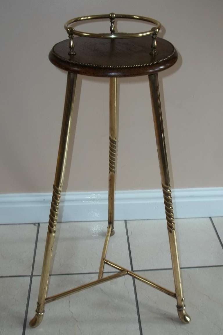 This is a High Quality GUERIDON or Candle Stand with a circular Mahogany top having a circular spindled brass gallery, supported on a three armed cast iron section, with tripod brass legs

This item has very fine detail;

1) wrythen leg supports