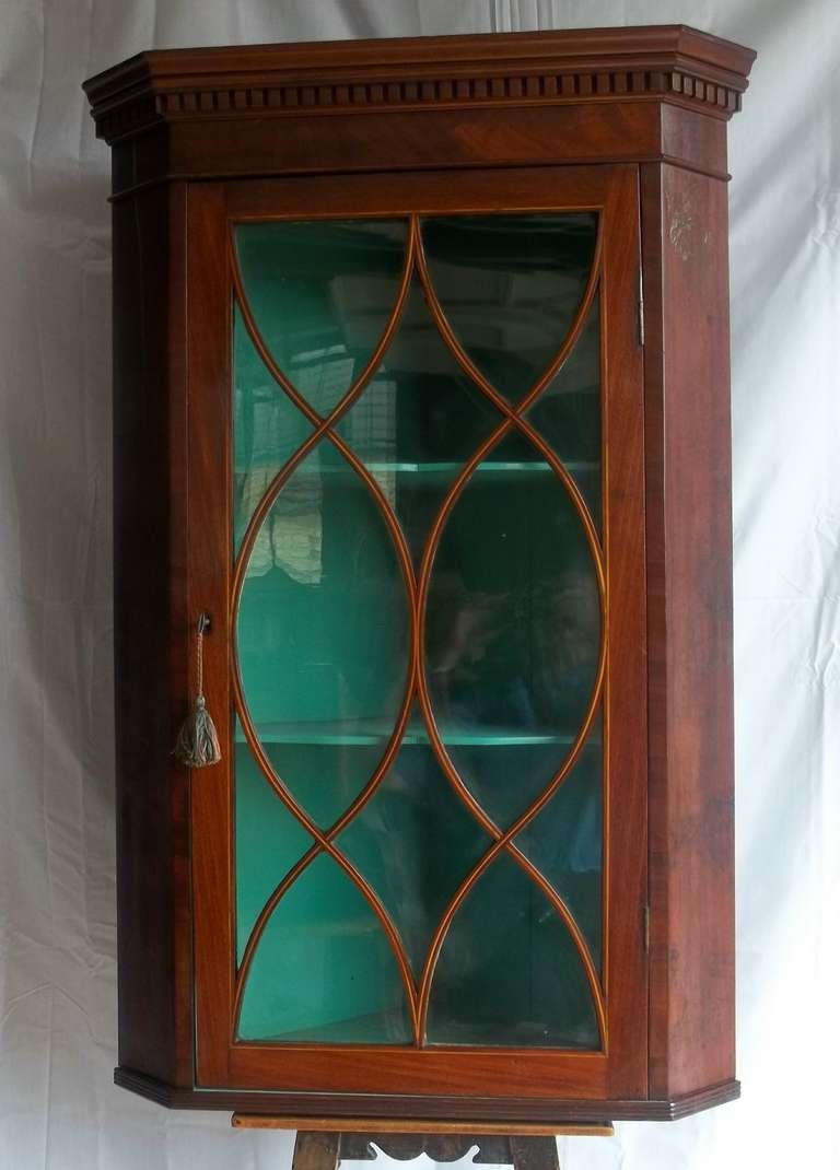 This is a Fine, High Quality example of an English, George 111, SHERATON Period, Mahogany Hanging CORNER CUPBOARD with a beautiful Astragal glazed, brass hinged door.

Most of these Corner Cupboards have solid wooden doors so it is unusual to find