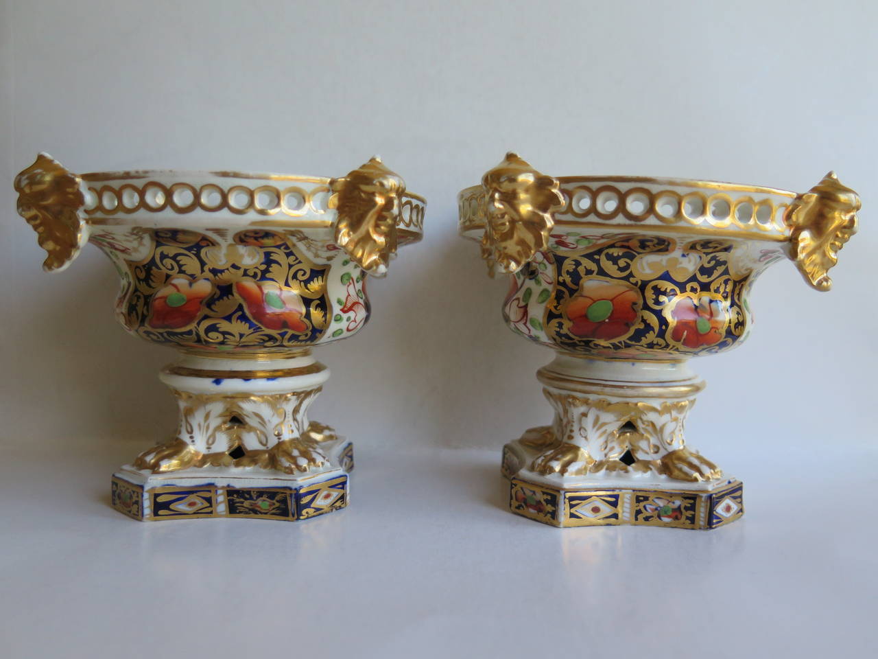 This is a rare pair of porcelain pot-Pourri urns made by the Derby factory, in the reign of George 111 in the early 19th century, circa 1815.
 
Each urn has a circular shape bowl section, supported on a quadro-form base. The design is classical