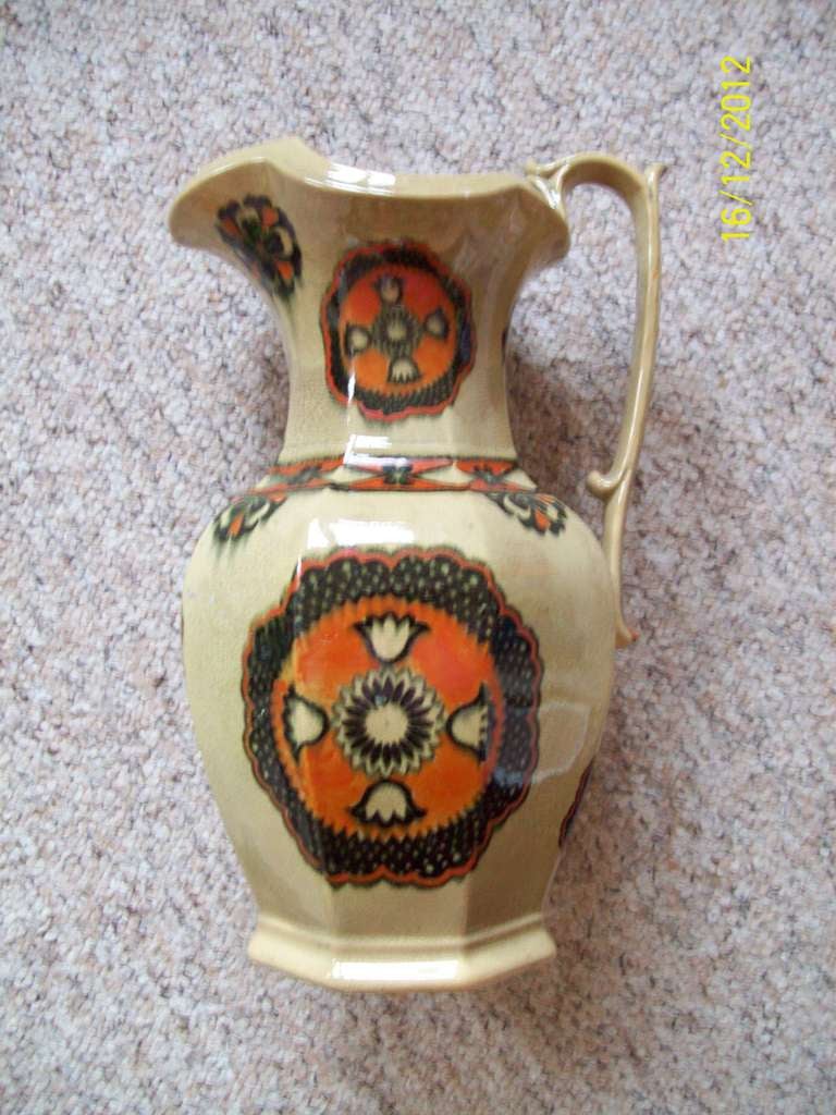 This is a RARE, Large and IMPORTANT  JUG made by MASONS IRONSTONE Pottery. 

The jug has an octagonal shape with a high loop handle having an upper thumb rest which is characteristic of Masons cups, mugs and jugs

This is one of the few wares