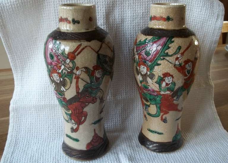 This is a good PAIR of VASES produced in China, in the late 19th Century.

The vases have a creamy crackle glaze ground. They are nicely hand decorated in polychrome enamels using burnt orange, green, soft yellow, blue, black and white colours. 
