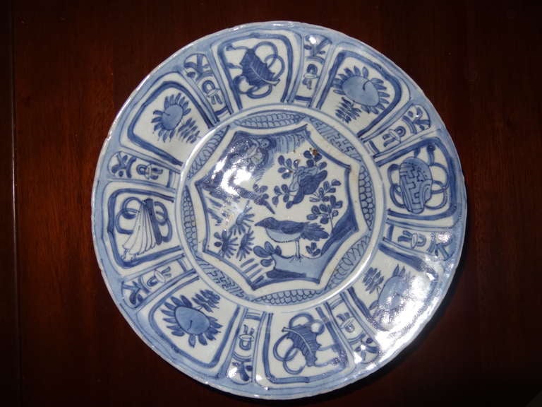 Ming Wanli period (1572-1620) Porcelain Bowl probably potted at the Jingdezhen kilns. The decoration in the usual blue illustrates a bird in the centre with peonies and on the rim chrysanthemums and scholars' motifs. 

Unsigned 

By, WANLI MING