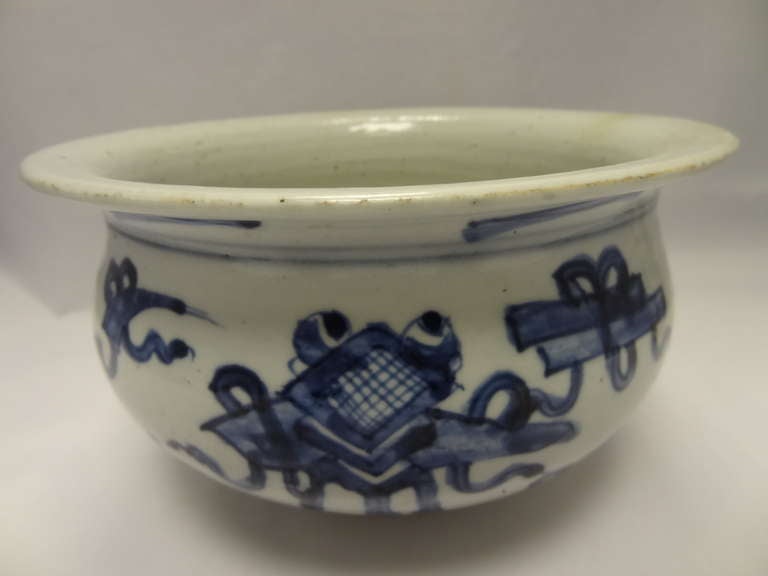 A Chinese Blue and White Circular Bowl, compressed and having an everted rim. Symbols relating to the Buddha are painted in underglaze blue. 

CHINESE SCHOOL SEVENTEENTH CENTURY (c.1700-1799)