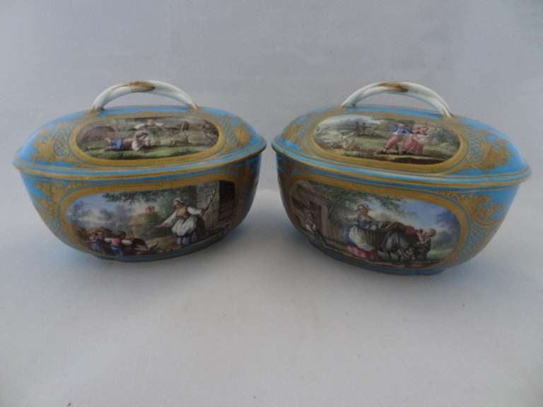 Porcelain tureens.This pair of beautifully decorated oval tureens depict named scenes of French life - le couvee renversee (the brood playing), le retour du marche (return from market), les petits espiegles (young ones playing), les petits mechants