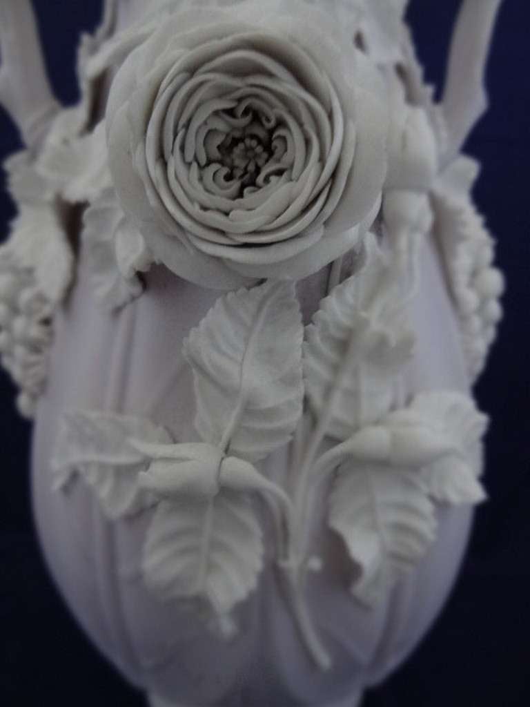 Parian Ware Vase, White floral and fruiting figures on a lilac ground. 

STAFFORDSHIRE (founded c.1820)

Shipping this item other than by personal collection/delivery (depending on  the address of the client) would damage the delicate porcelain